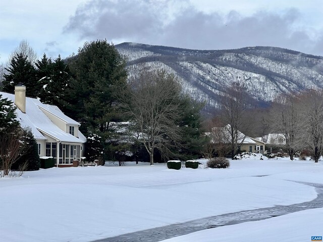 surrounding community with a mountain view