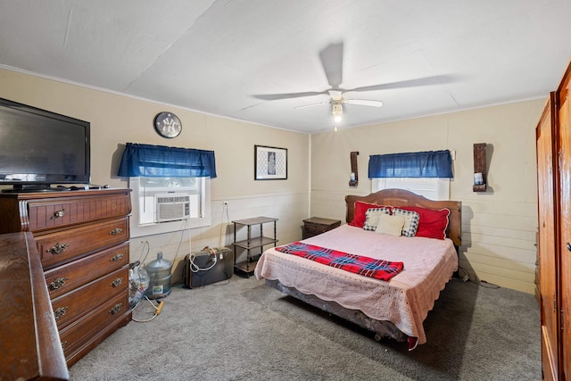 bedroom with a ceiling fan, cooling unit, and carpet flooring