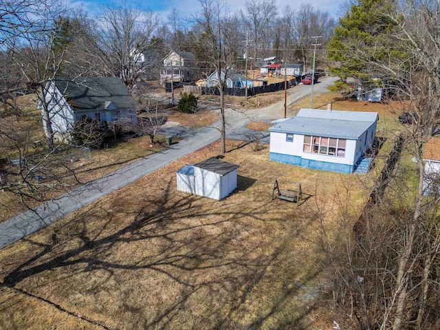 birds eye view of property with a residential view