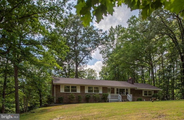 ranch-style home featuring a front yard and a porch