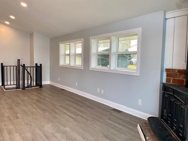 living room with hardwood / wood-style flooring and plenty of natural light