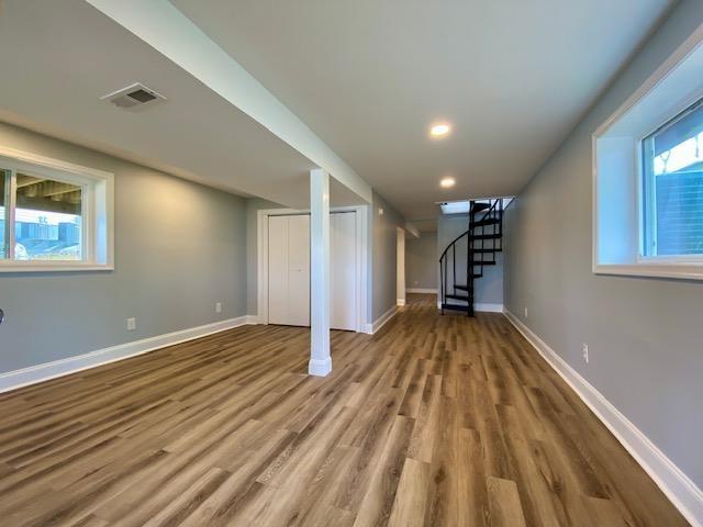 basement featuring hardwood / wood-style flooring