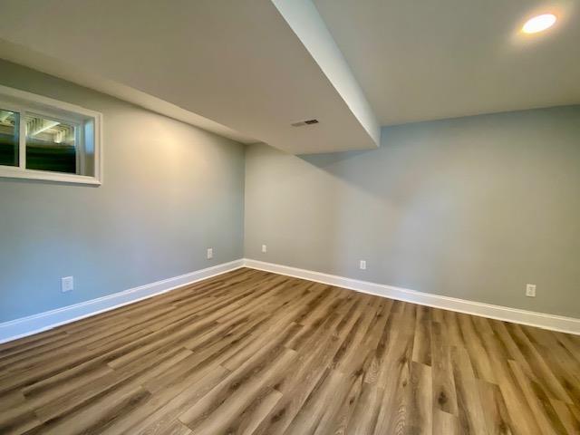 basement featuring hardwood / wood-style flooring