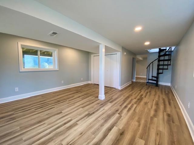 basement featuring light wood-type flooring