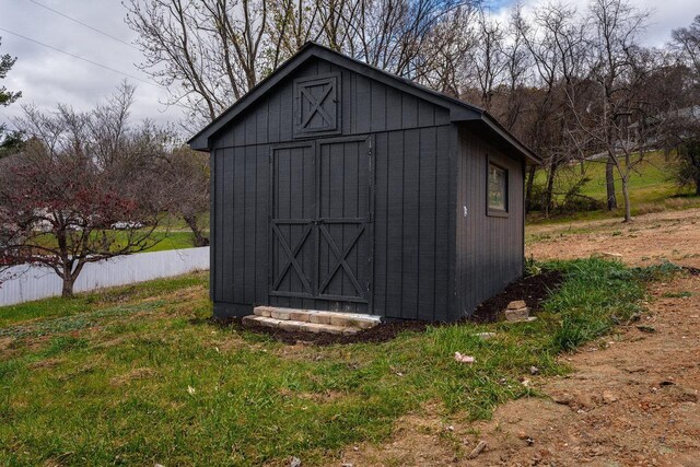 view of outbuilding with a lawn