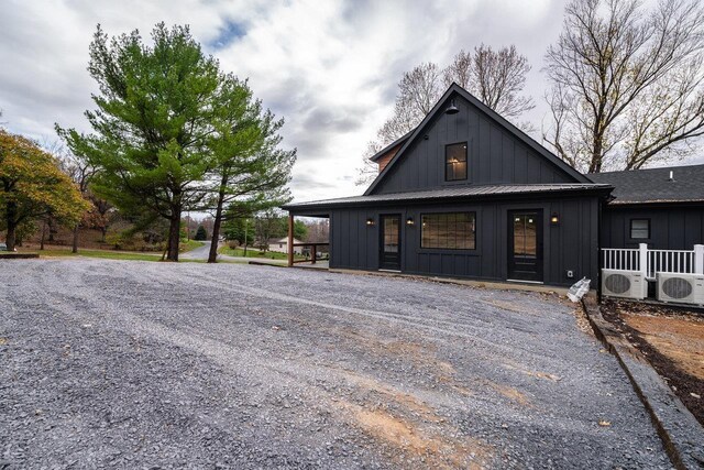 view of front of property with ac unit