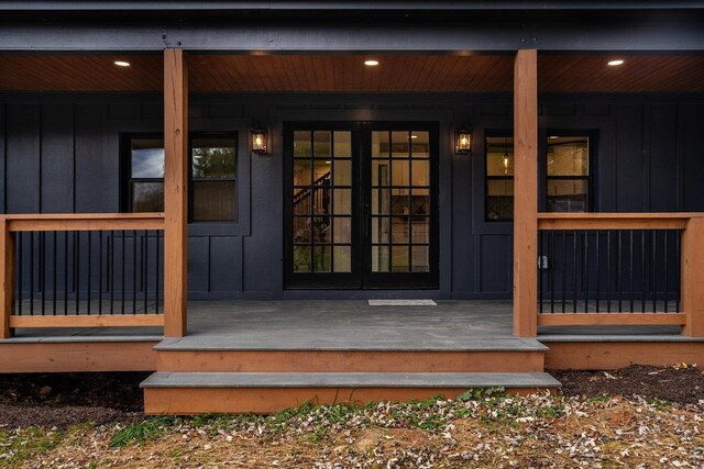 property entrance featuring french doors and a porch