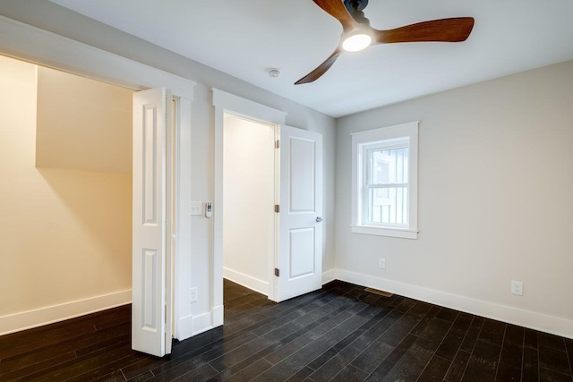 unfurnished bedroom featuring ceiling fan and dark hardwood / wood-style floors