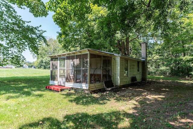 view of outbuilding with a yard