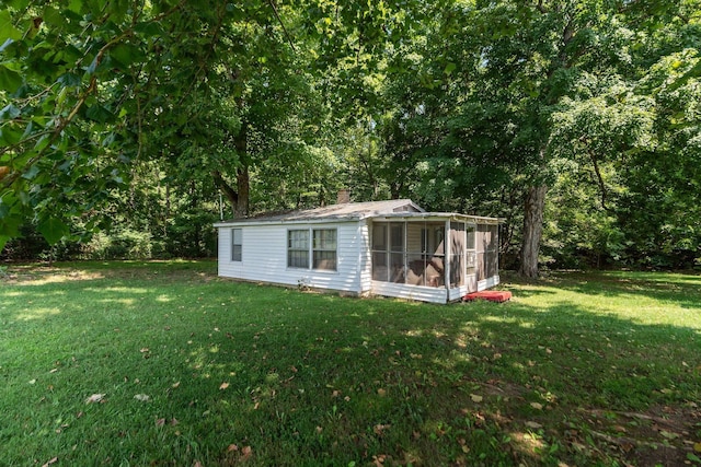 view of outbuilding with a yard