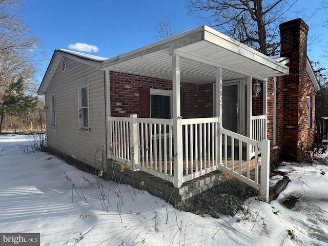 view of snow covered property