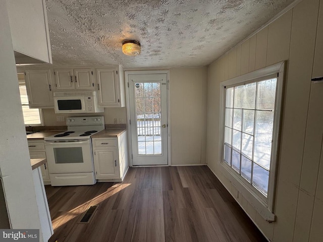 kitchen featuring white cabinetry, white appliances, and dark wood-type flooring