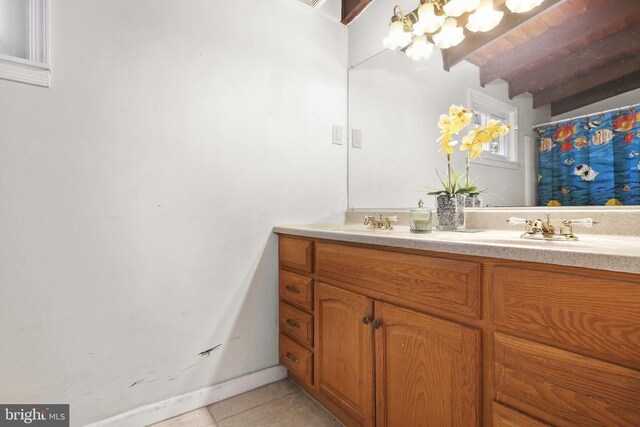 bathroom with vanity and tile patterned floors