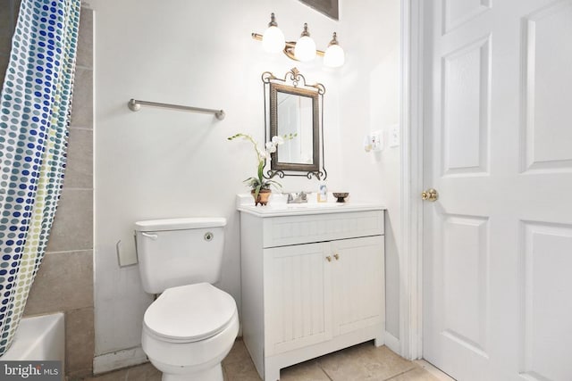 full bathroom featuring vanity, shower / tub combo with curtain, tile patterned floors, and toilet