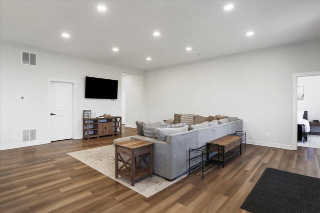 living room with dark hardwood / wood-style floors