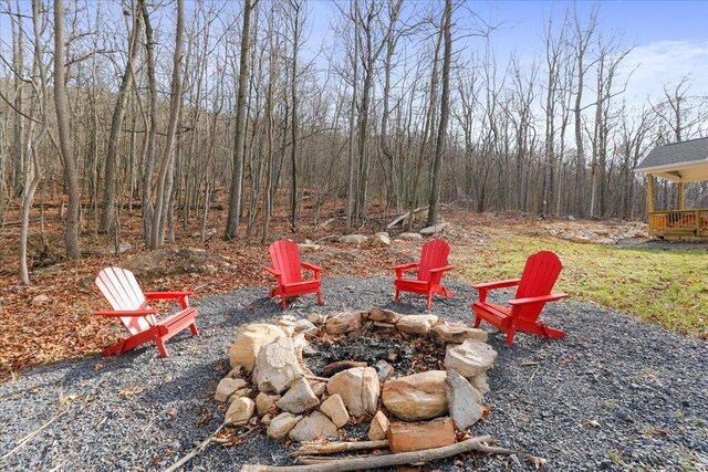 view of yard with an outdoor fire pit