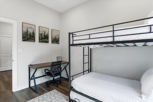 bedroom featuring dark wood-type flooring