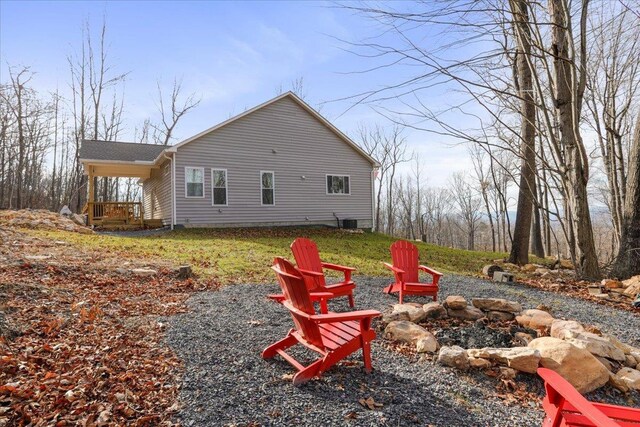 back of property with a fire pit