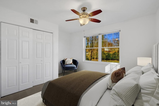 bedroom featuring visible vents, a closet, and ceiling fan