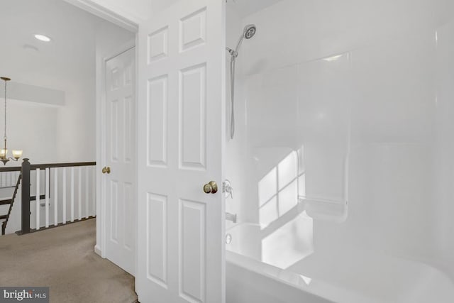 full bathroom with an inviting chandelier and  shower combination