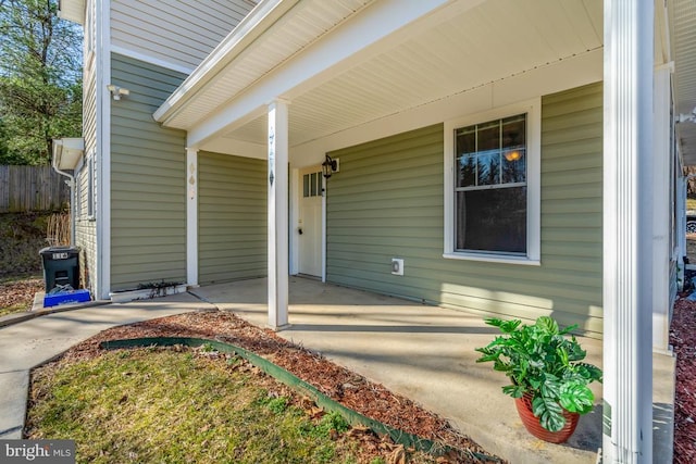 property entrance with covered porch