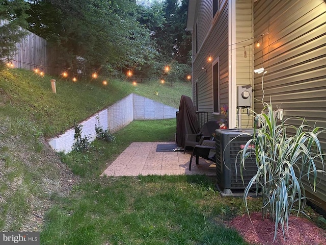 view of yard featuring cooling unit, a patio, and fence