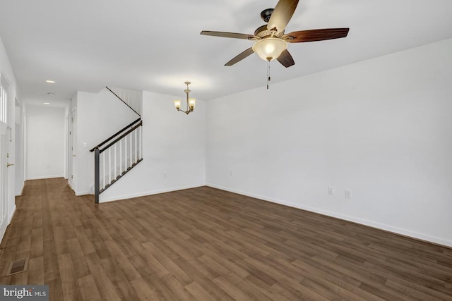 empty room featuring visible vents, baseboards, stairs, recessed lighting, and wood finished floors