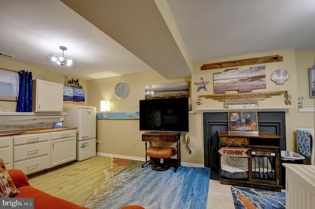 living room with visible vents and baseboards