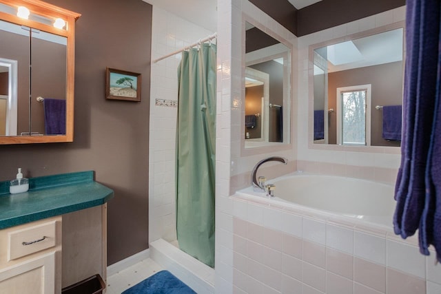 bathroom featuring vanity and plus walk in shower