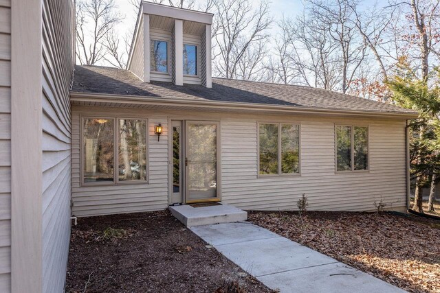 snow covered property with a wooden deck