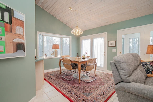 dining space with vaulted ceiling, light tile patterned floors, a notable chandelier, and wood ceiling