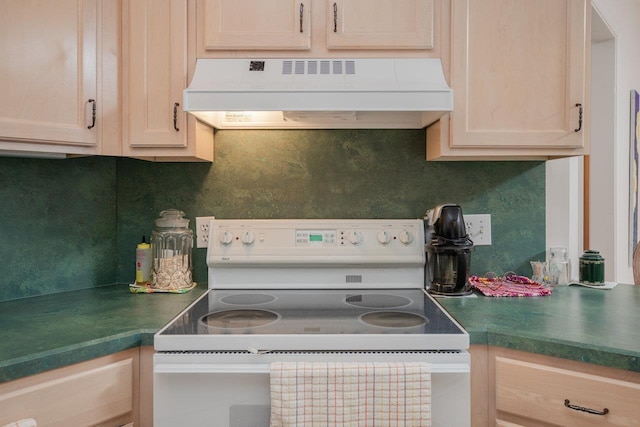 kitchen featuring decorative backsplash, light brown cabinets, exhaust hood, and white electric range oven