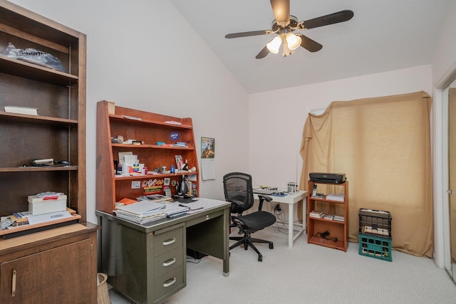 carpeted home office featuring ceiling fan and vaulted ceiling