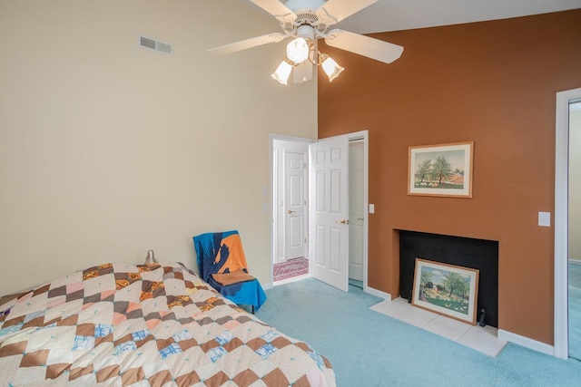 carpeted bedroom featuring ceiling fan and lofted ceiling