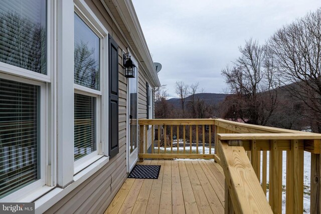 wooden terrace with a mountain view