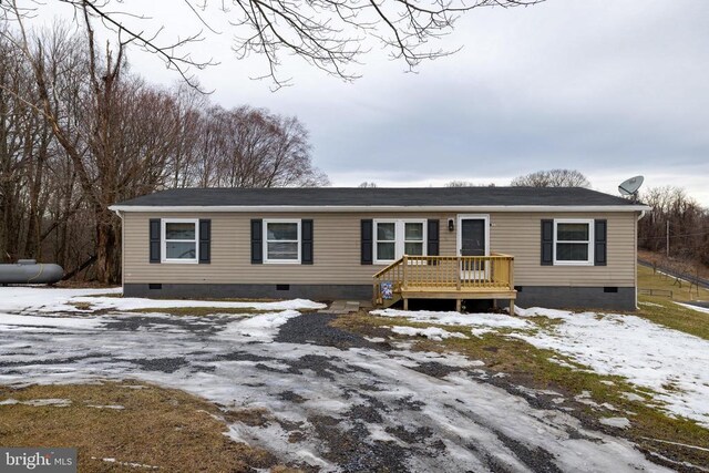 view of front of property with a wooden deck