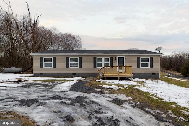 view of front of home with a wooden deck