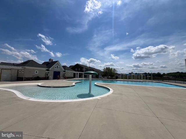 pool featuring a patio and fence