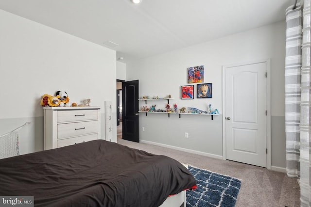 bedroom with baseboards and carpet flooring