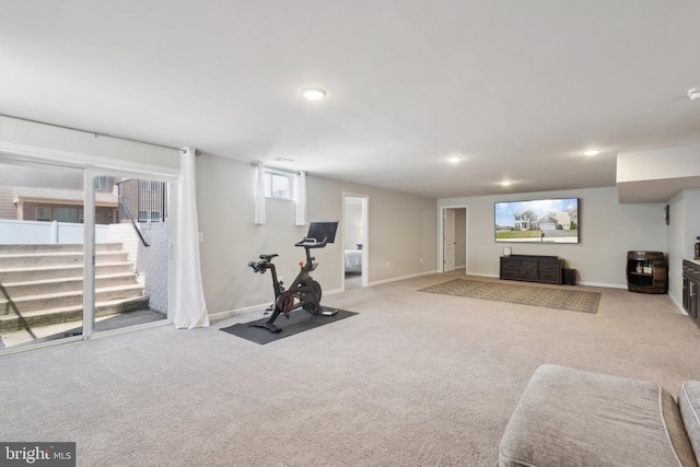 exercise room with baseboards, recessed lighting, and carpet floors
