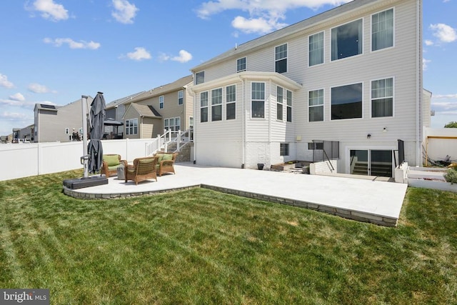 back of house with a patio, fence, a lawn, and a residential view