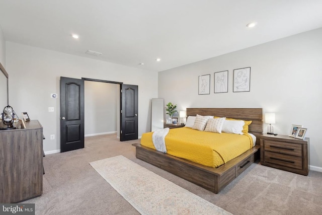 bedroom featuring baseboards, light carpet, and recessed lighting
