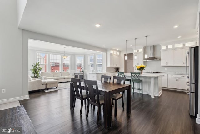 dining space featuring baseboards, dark wood-type flooring, and recessed lighting