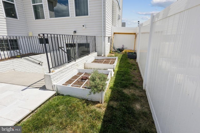 view of yard featuring a garden and fence