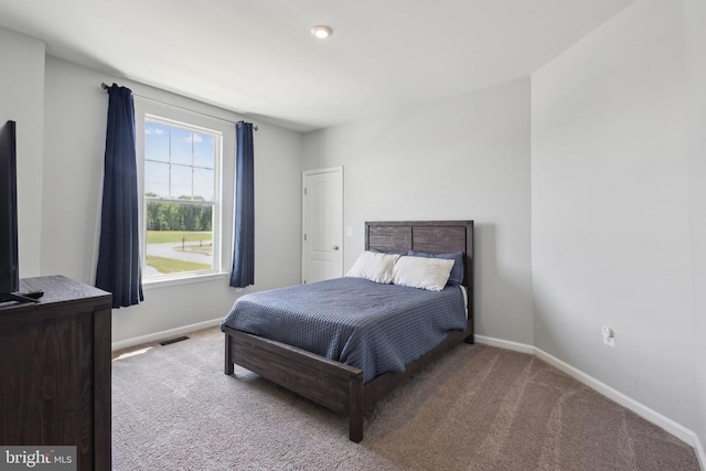 bedroom featuring carpet, baseboards, and visible vents