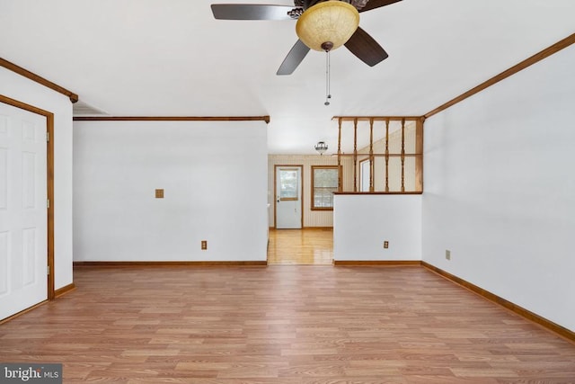 unfurnished living room with ceiling fan, crown molding, light wood-type flooring, and baseboards