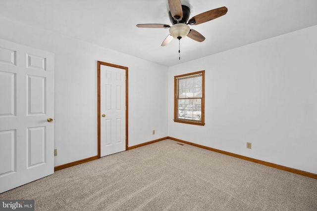 unfurnished bedroom featuring baseboards, ceiling fan, and carpet flooring