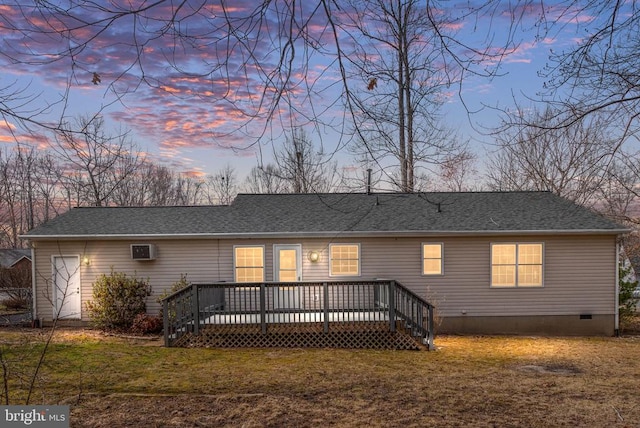 back of house featuring crawl space, a wooden deck, a yard, and roof with shingles