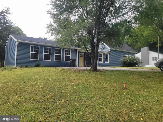 ranch-style home with a front yard