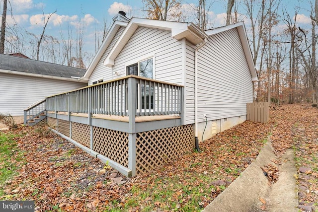 view of side of property with a deck